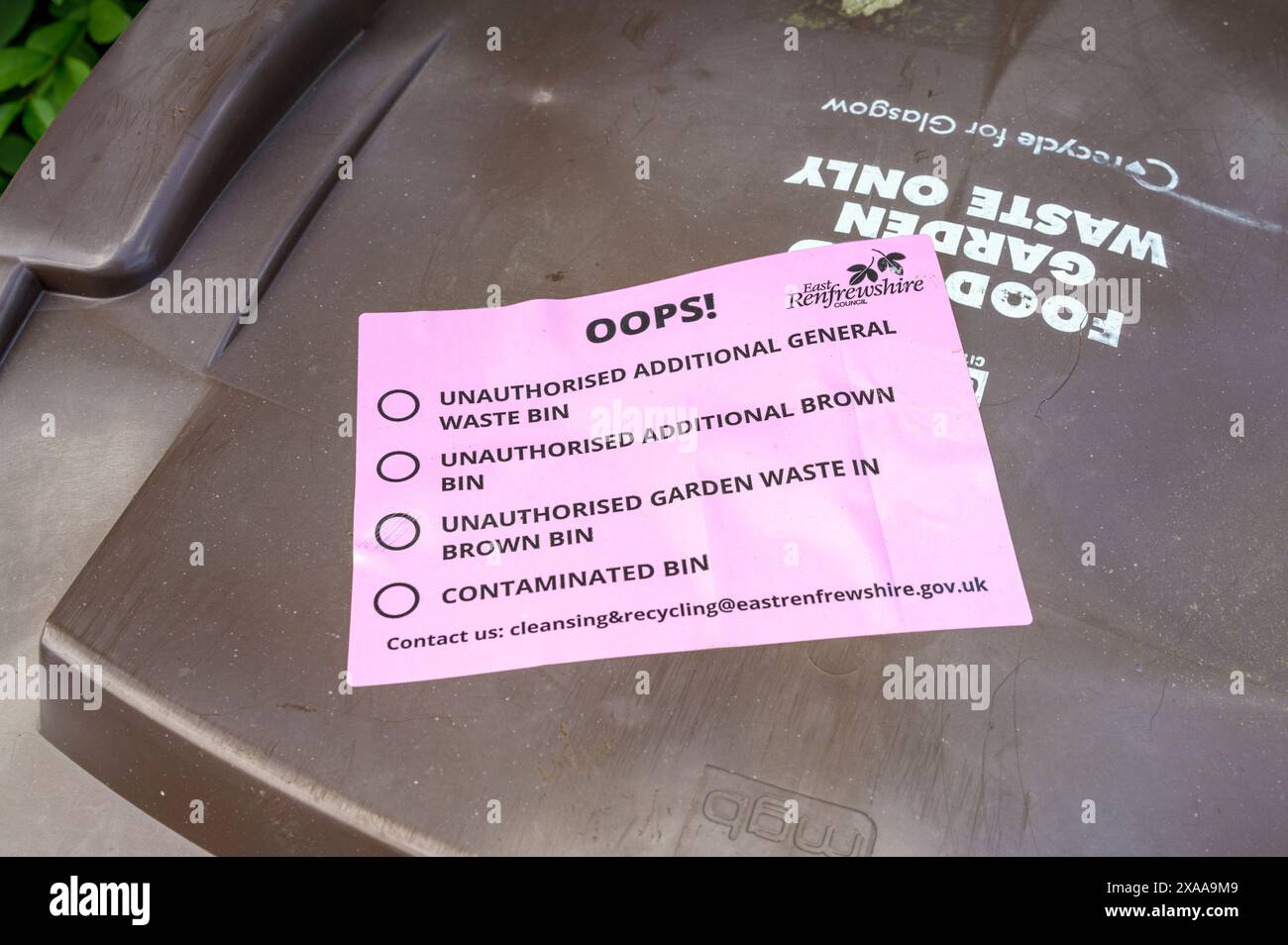 Unauthorised Garden Waste Notice on a brown recycling bin, East