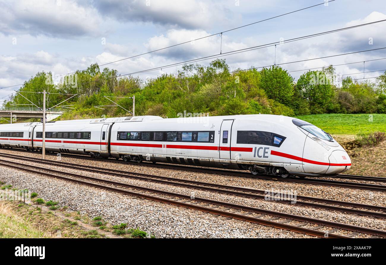 Hebertshausen, Germany, 10th Apr 2024: An ICE 3 (DB series 403) from Deutsche Bahn on the train route between Munich and Nuremberg. (Photo by Jonas Ph Stock Photo