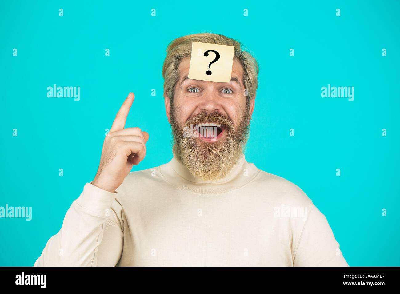 Man with question mark on forehead. Paper notes with question marks. Beard man question mark in head, solution problems. Thinking man with question Stock Photo