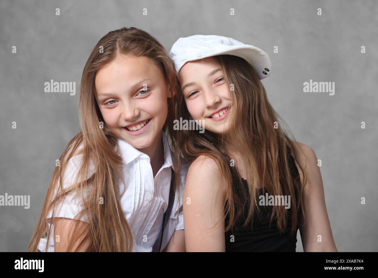 portrait of two cheerful preteen girls Stock Photo - Alamy