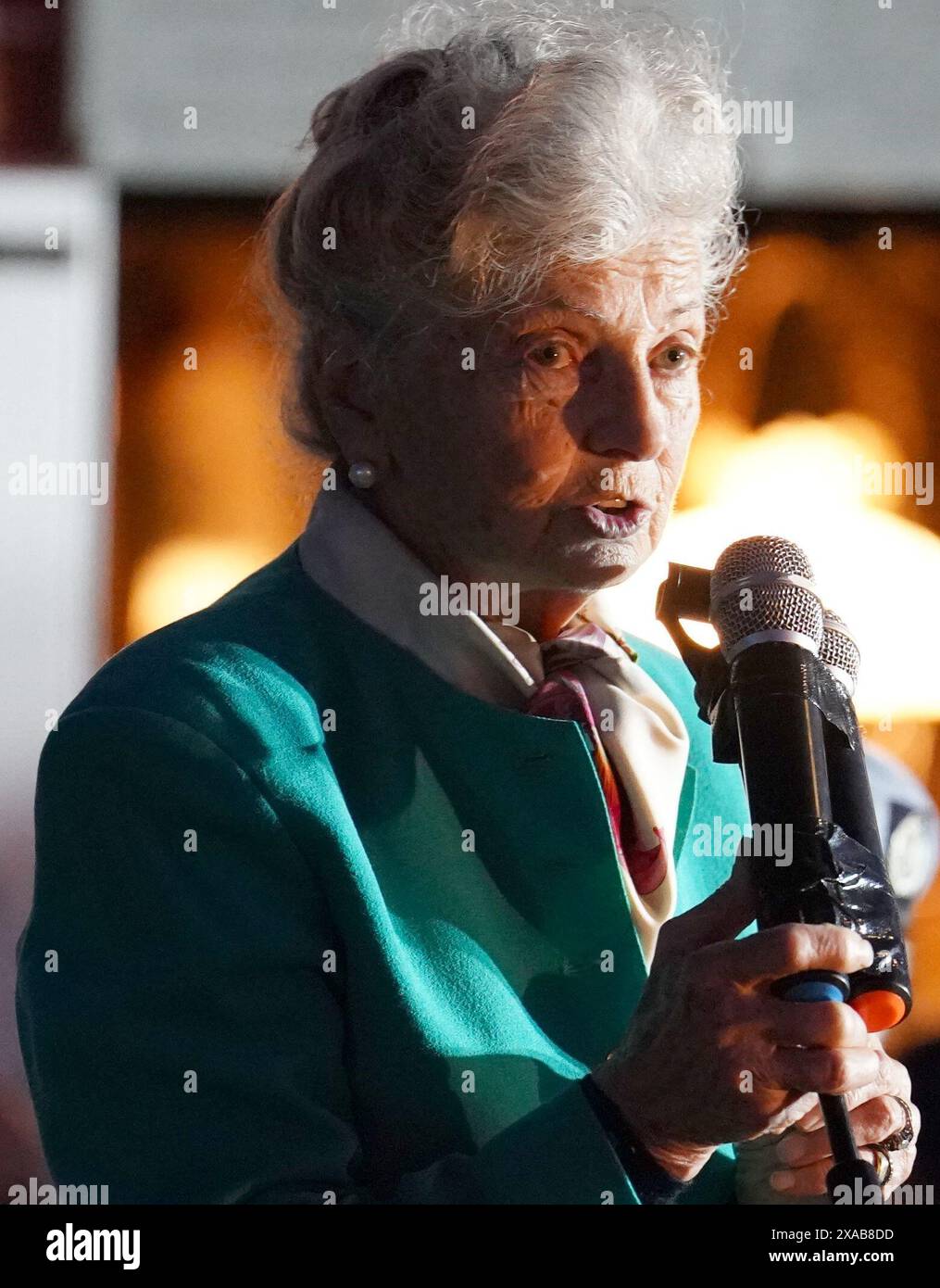 84-year-old Arlette Gondree speaking before giving a champagne toast to D-Day veterans at 2316 in the evening, marking the exact moment 80 years ago that British troops entered her family's cafe in Benouville, Normandy, France, making them the first family to be liberated from German control. Picture date: Wednesday June 5, 2024. Stock Photo