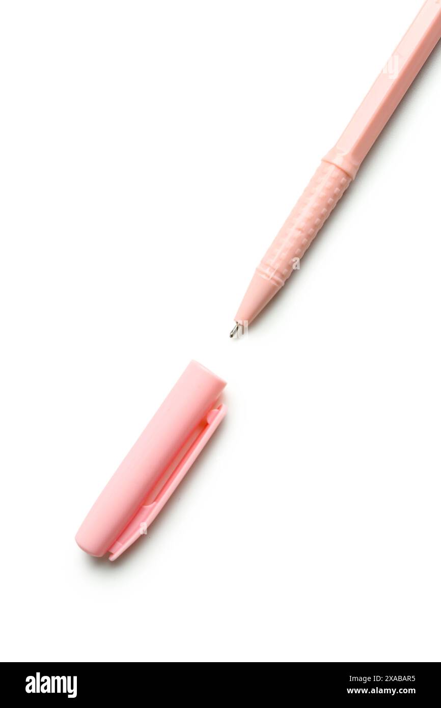 Pink ballpoint pen with cap on white background Stock Photo