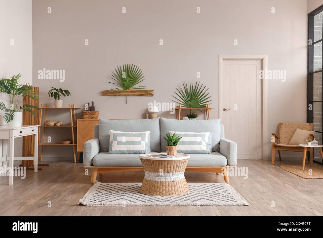 Interior of living room with grey sofa and table Stock Photo - Alamy