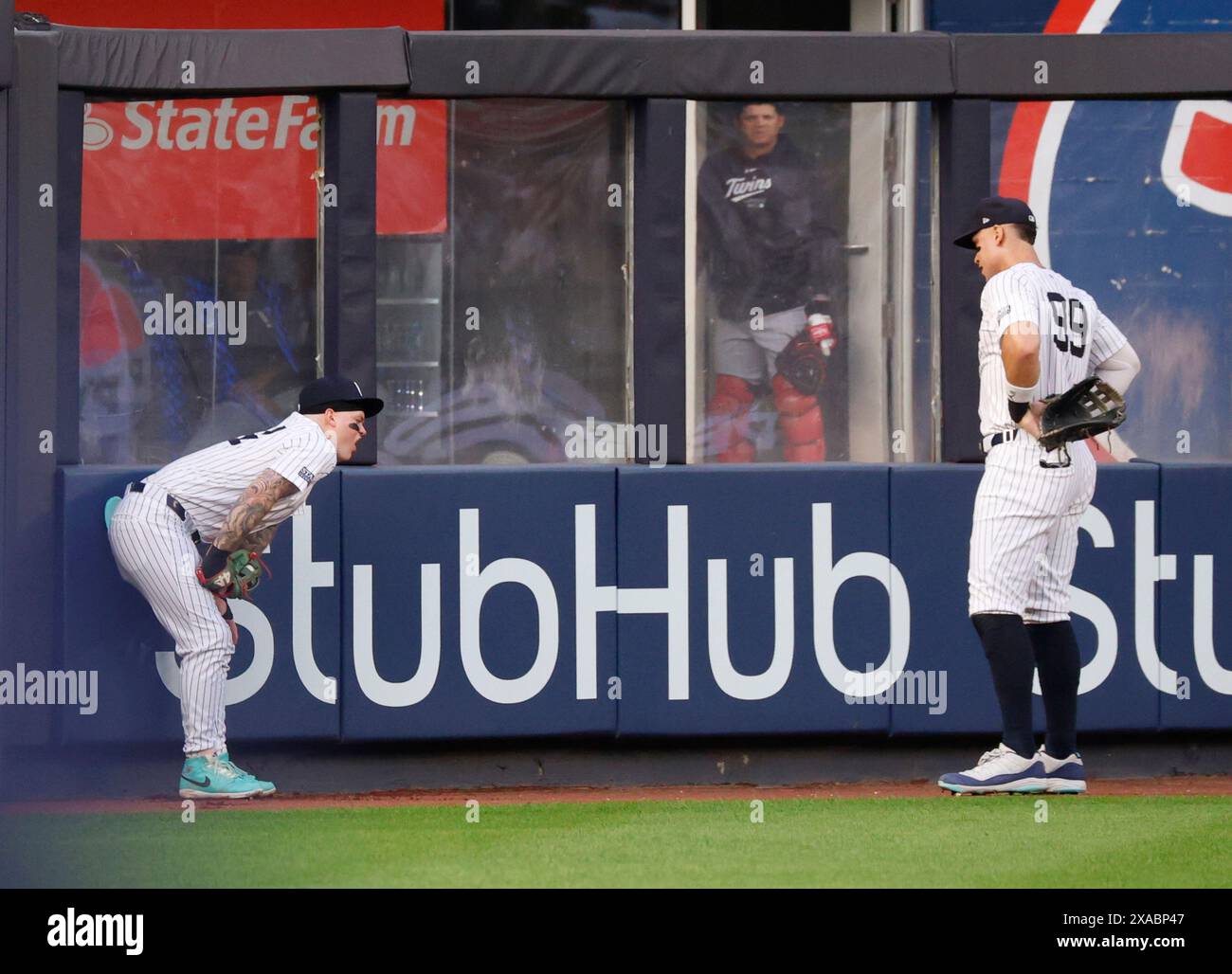 Bronx, United States. 05th June, 2024. New York Yankees Aaron Judge comes over to Alex Verdugo who reacts after making a running catch at the wall in the second inning against the Minnesota Twins at Yankee Stadium on Wednesday, June 5, 2024 in New York City. Photo by John Angelillo/UPI Credit: UPI/Alamy Live News Stock Photo