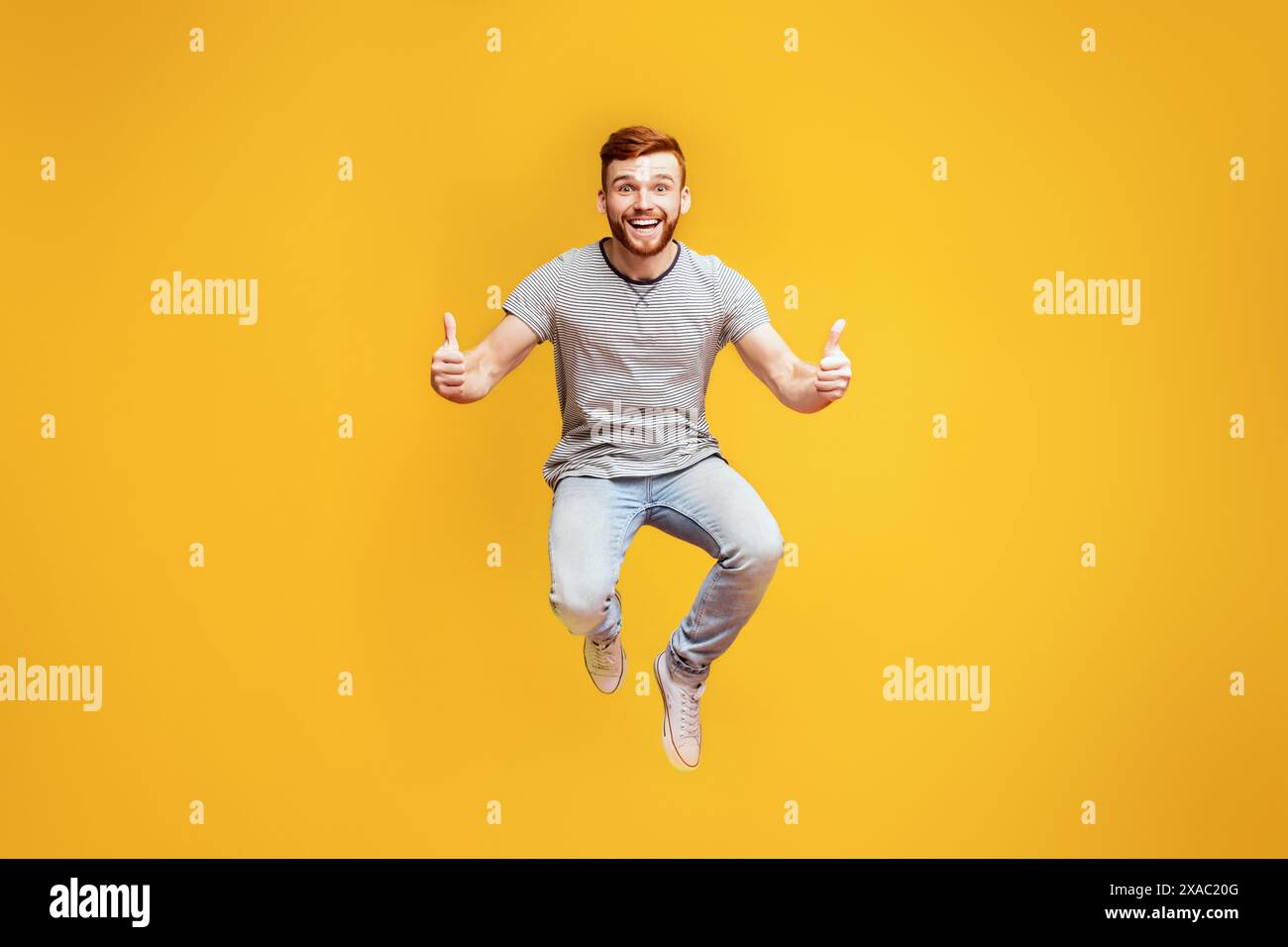Happy redhead man jumping hi-res stock photography and images - Alamy