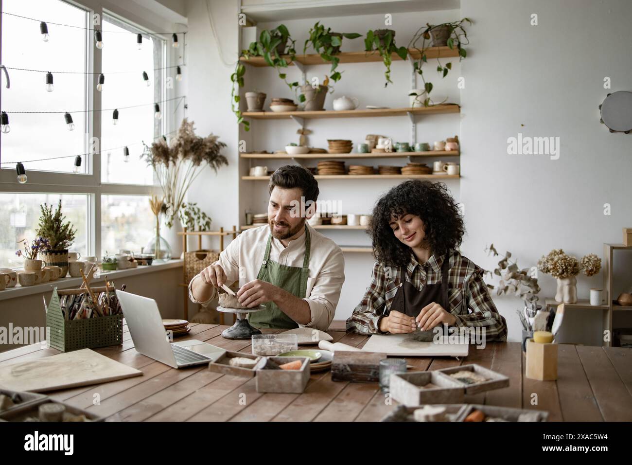 Bearded mature man woman sculpting hi-res stock photography and images ...