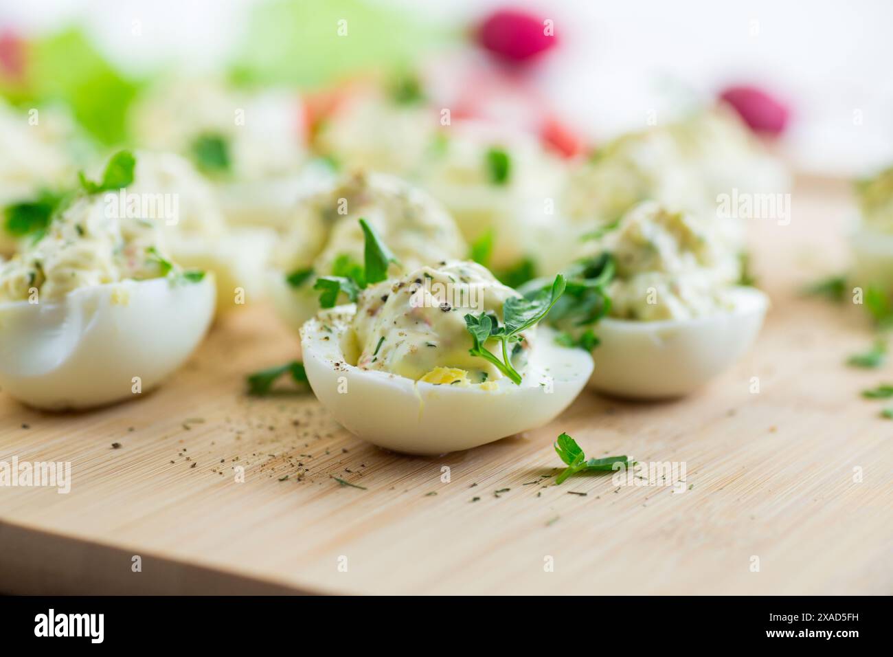 stuffed eggs, deviled eggs on a wooden table . Stock Photo