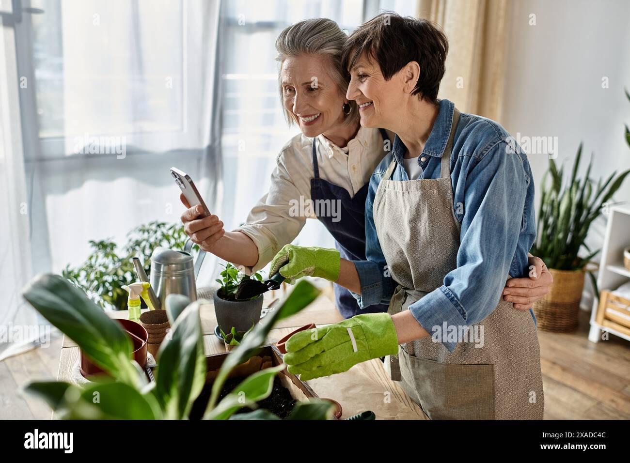 Two mature women happily hi-res stock photography and images - Alamy