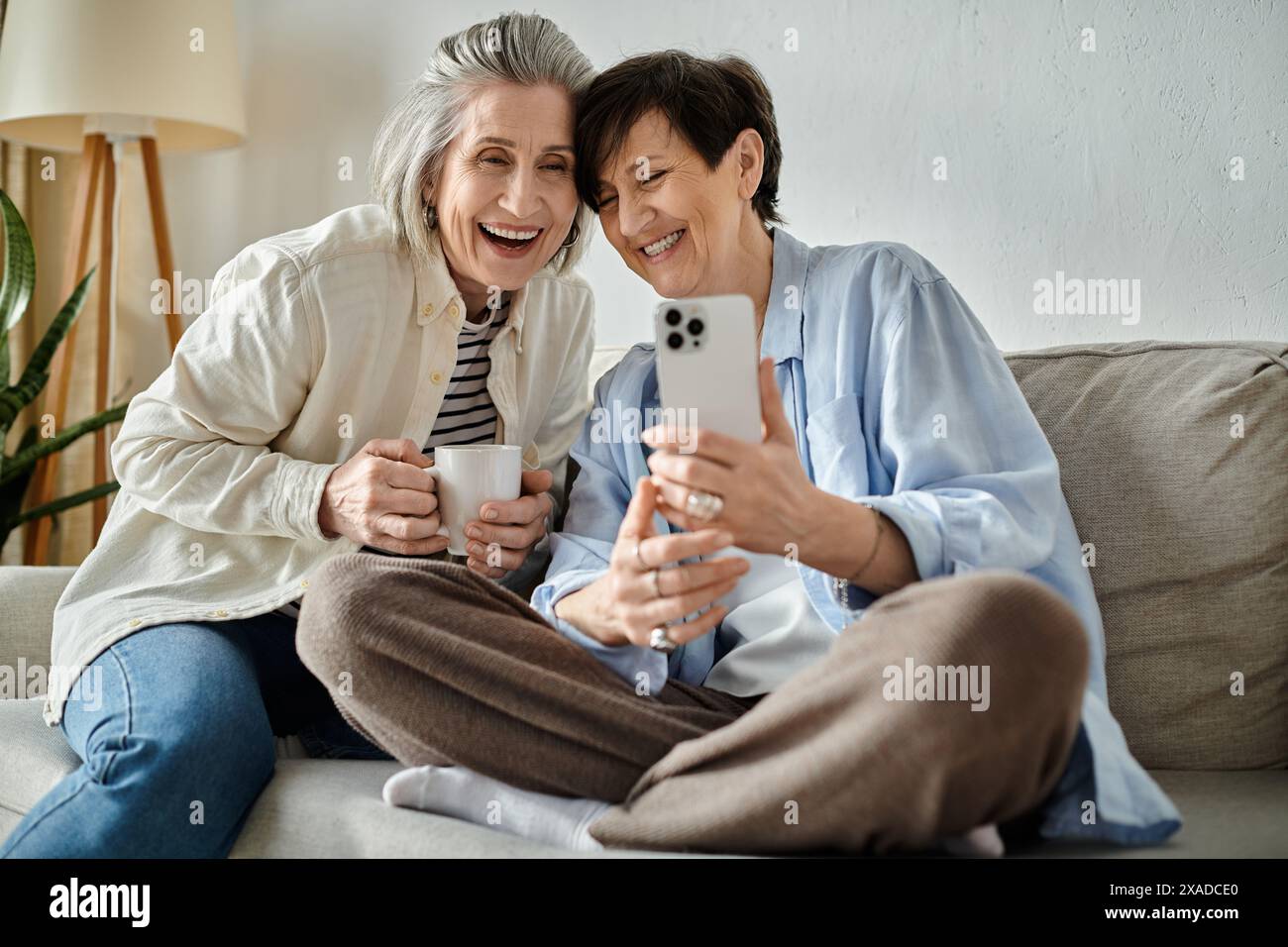 Two mature women happily hi-res stock photography and images - Alamy