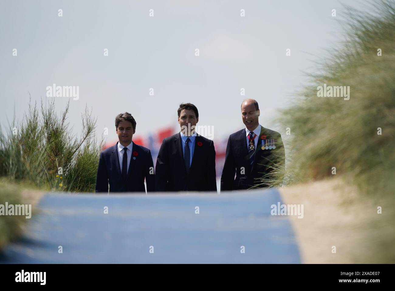 The Prince of Wales, Canadian Prime Minister Justin Trudeau, and Prime Minister of France Gabriel Attal at the Government of Canada ceremony to mark the 80th anniversary of D-Day, at Juno Beach in Courseulles-sur-Mer, Normandy, France. Picture date: Thursday June 6, 2024. Stock Photo