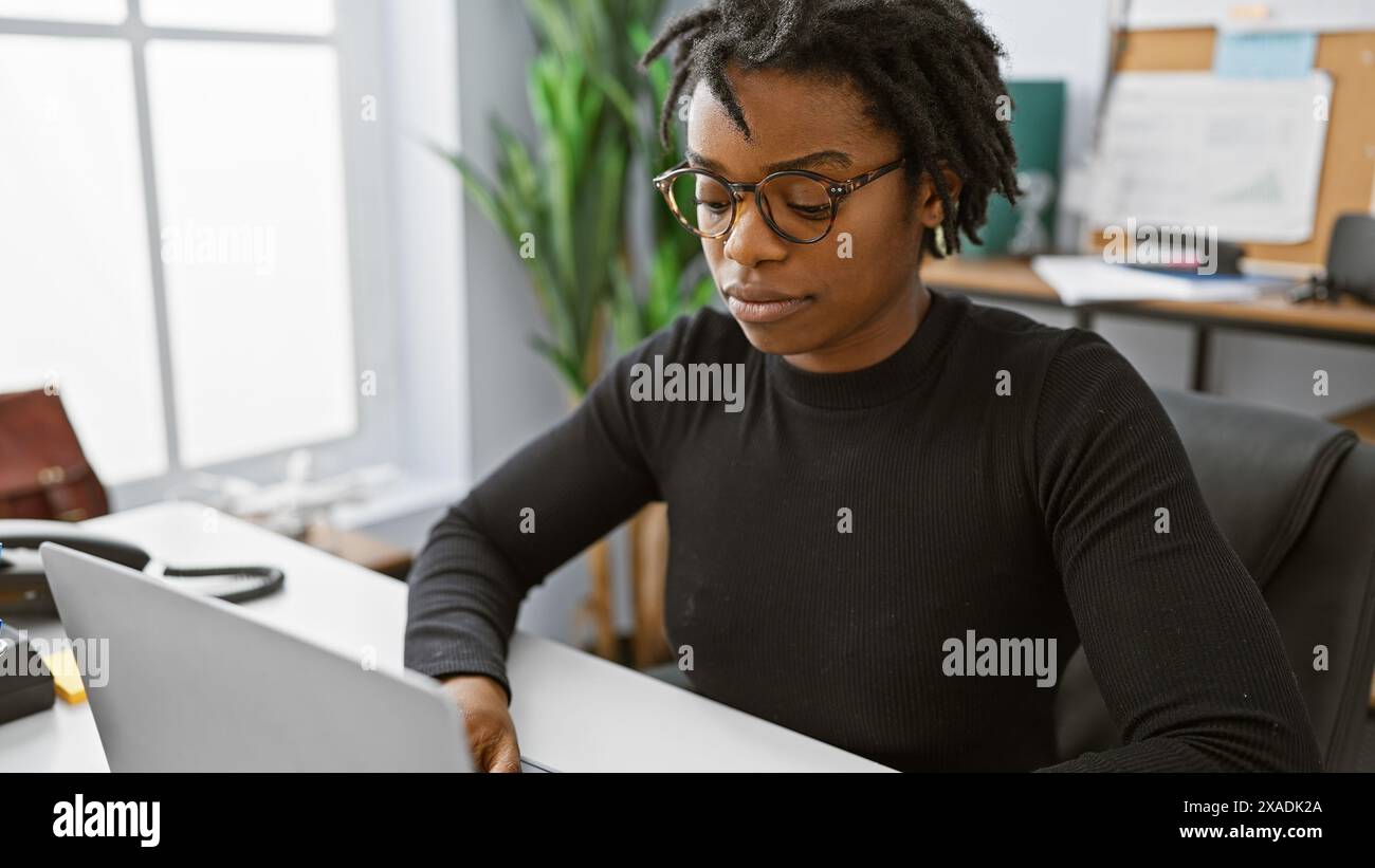 Focused black woman dreadlocks hi-res stock photography and images - Alamy