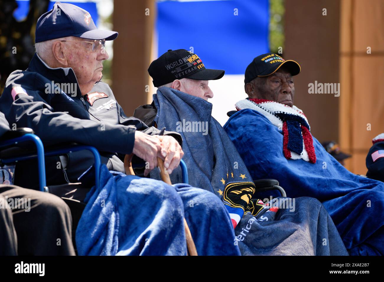 World War II veterans listen during a ceremony to mark the 80th ...