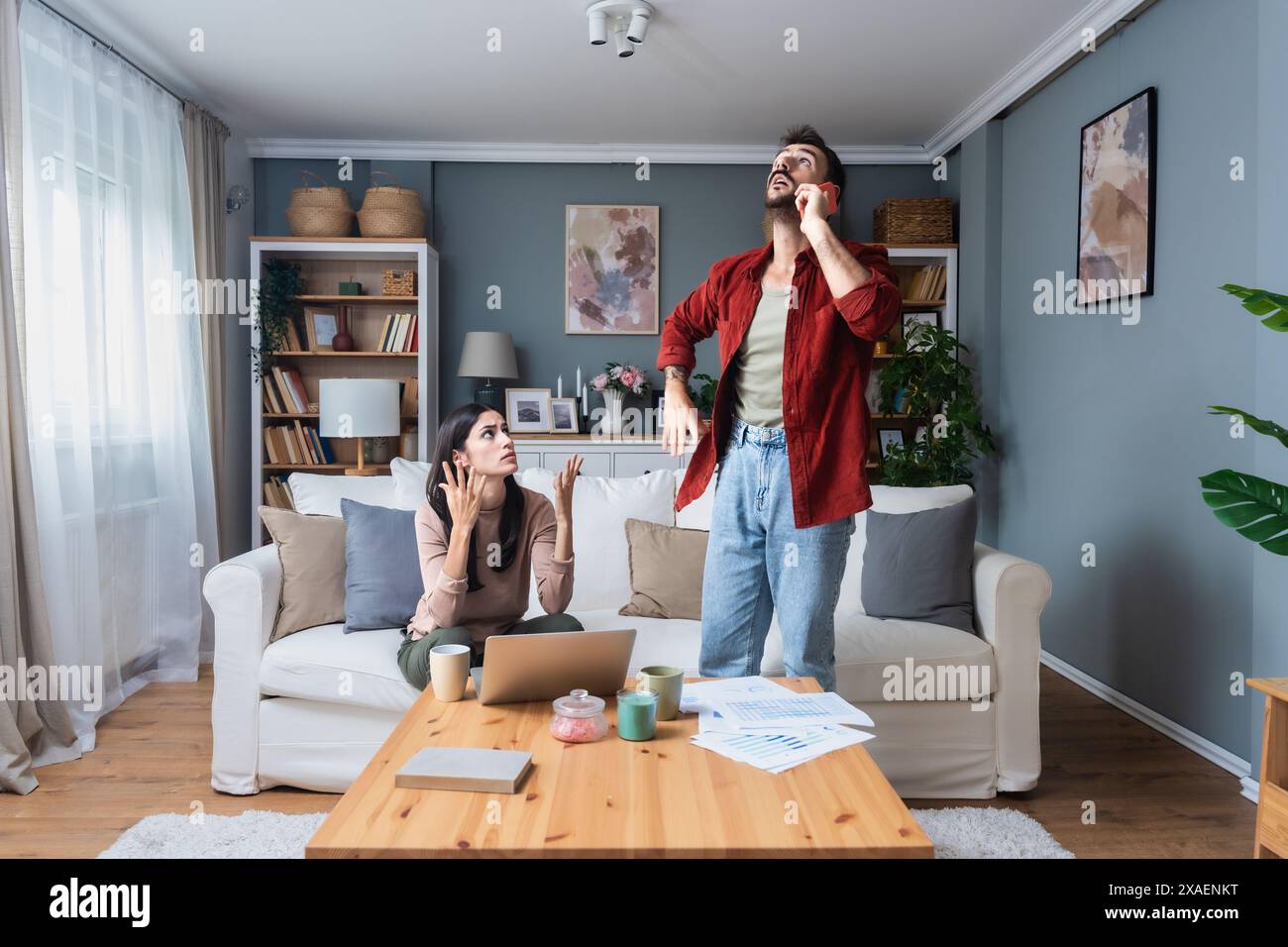 Young couple calling police to report domestic violence. Man and woman