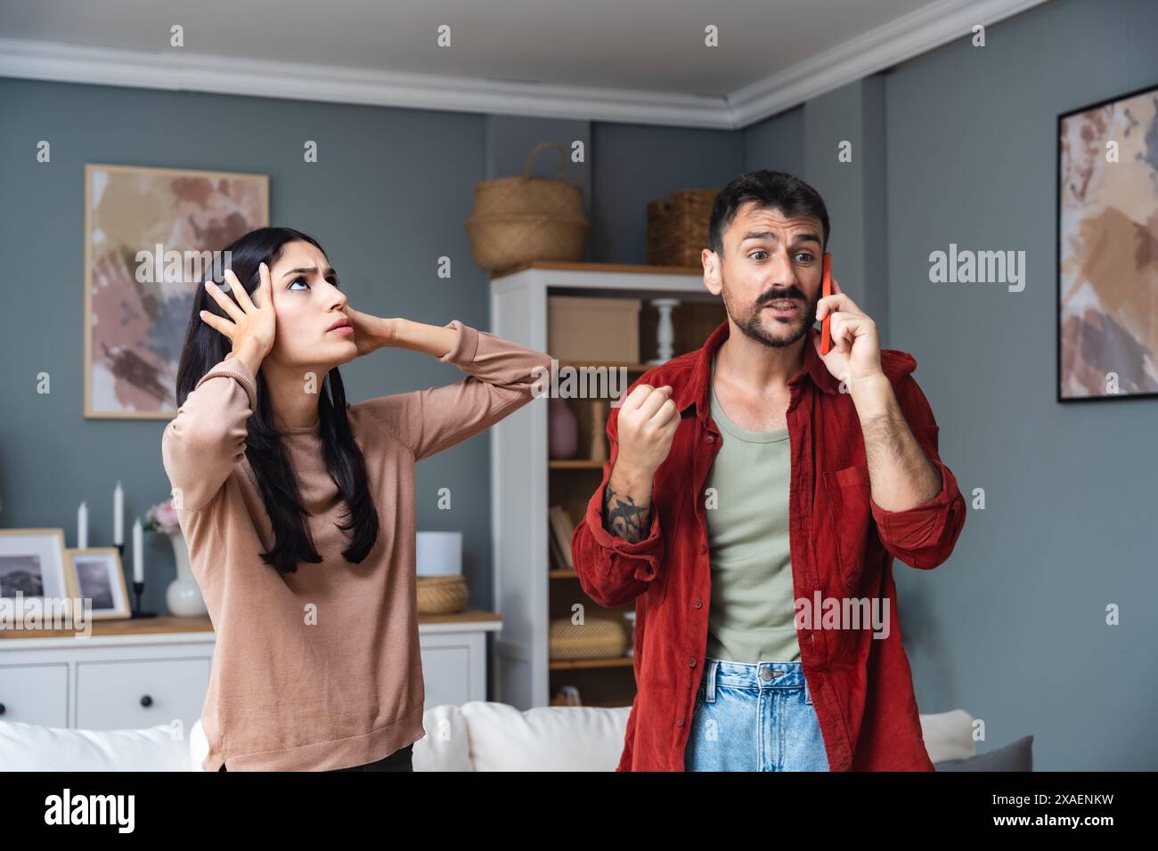 Young couple calling police to report domestic violence. Man and woman