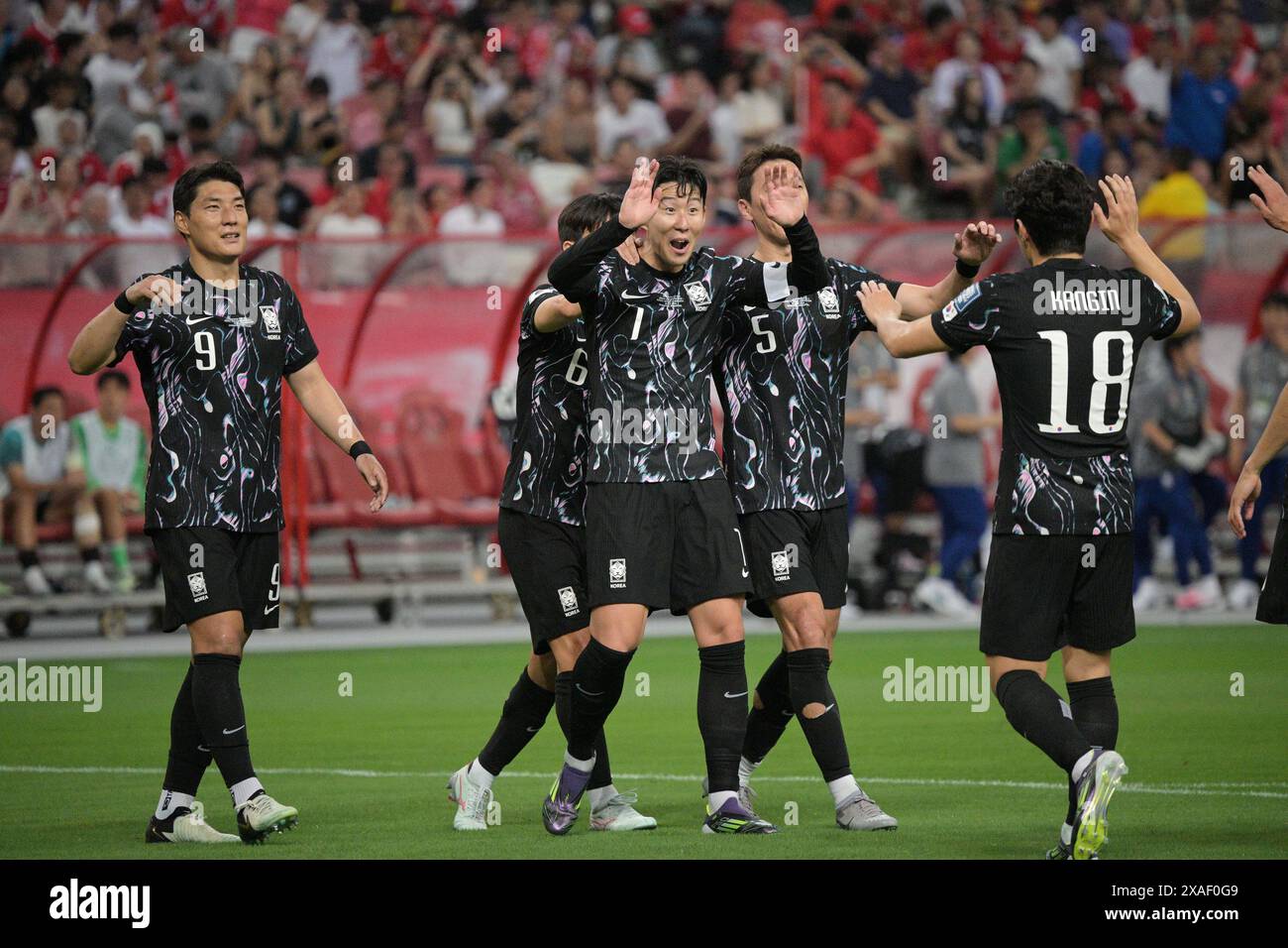 Singapore. 6th June, 2024. Son Heung-Min (3rd R) of South Korea celebrates  scoring a goal during the Group C match of 2026 FIFA World Cup Asian  qualifiers between Singapore and South Korea