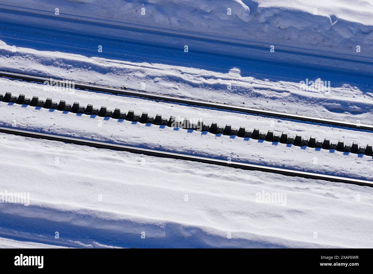 Snowy cogwheel railroad equipped with a rack rail using the Abt system ...