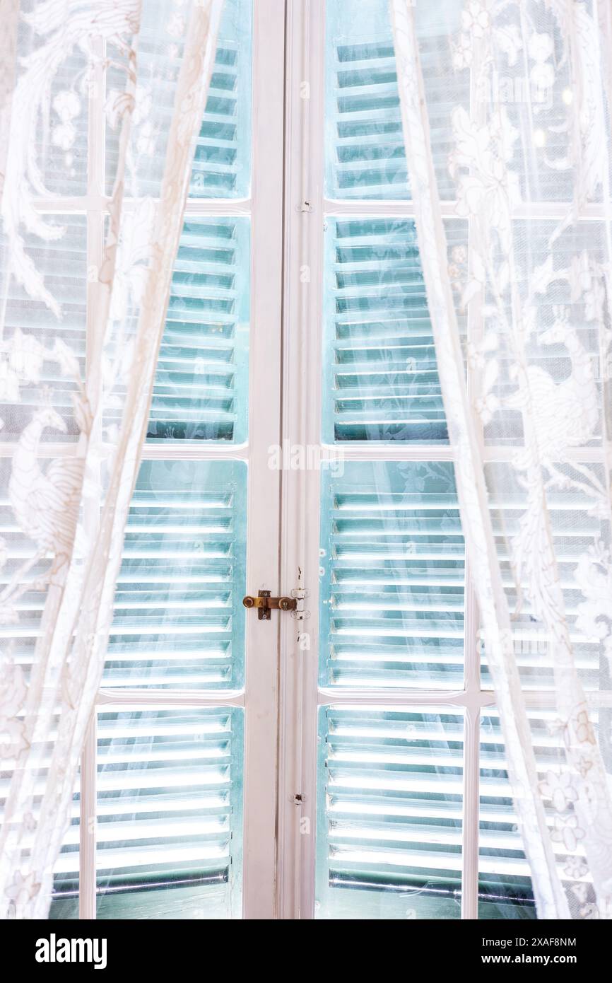 Beautiful wooden shutters in the Mediterranean style closed from the ...