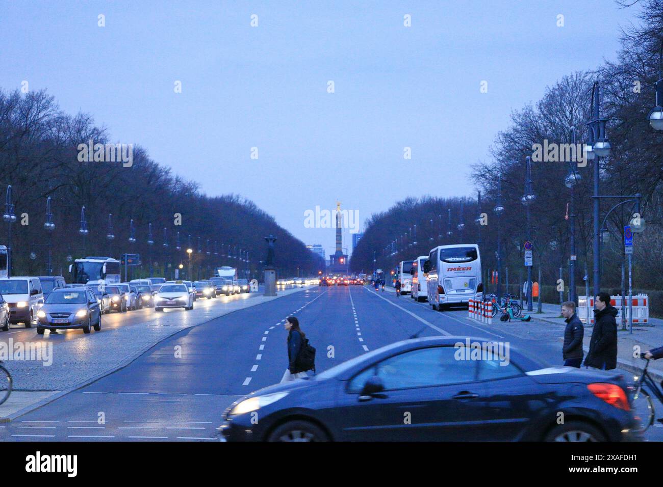 Berlin in Germany - March 13 2024: The magnificent Siegessäule (Victory Column) seen from the Brandenburg Gate in the evening Stock Photo