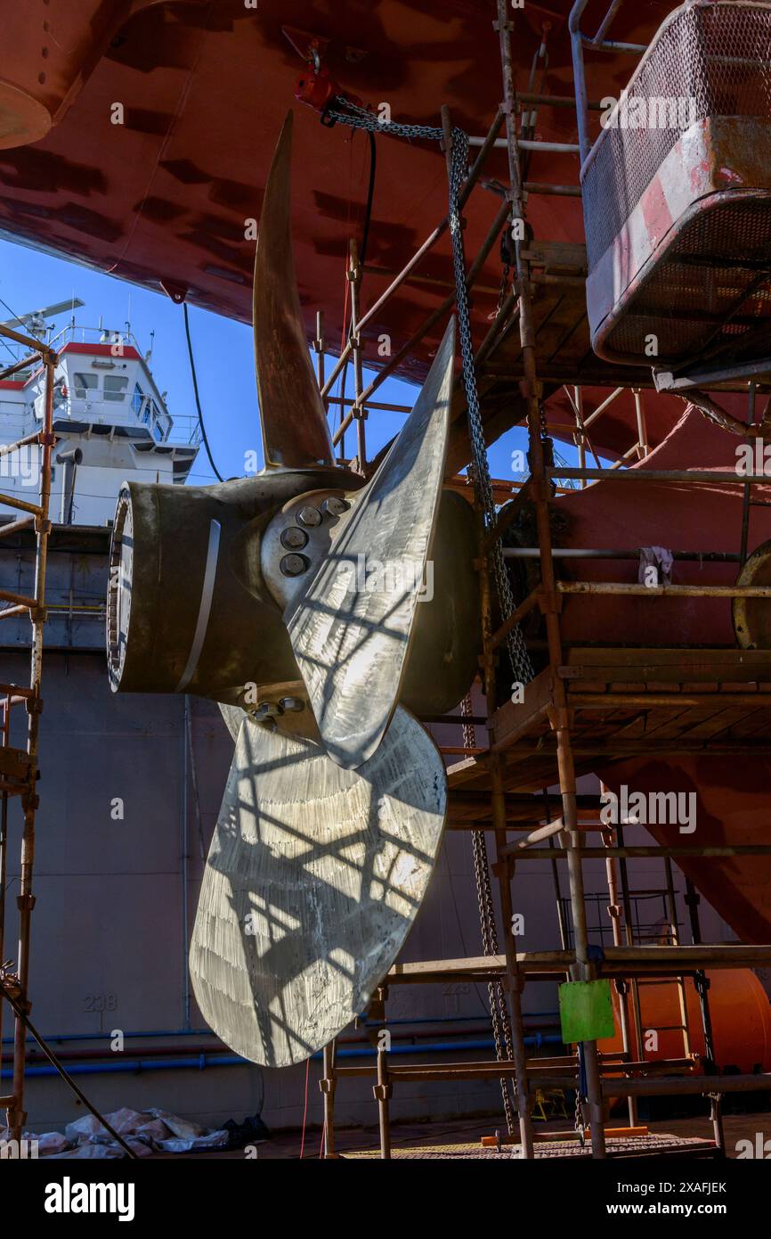 Pitch Rudder Cargo vessel in dry dock on ship repairing yard. Variable pitch ...