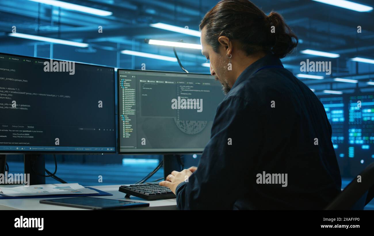 System admin focused on programming in server room housing advanced ...