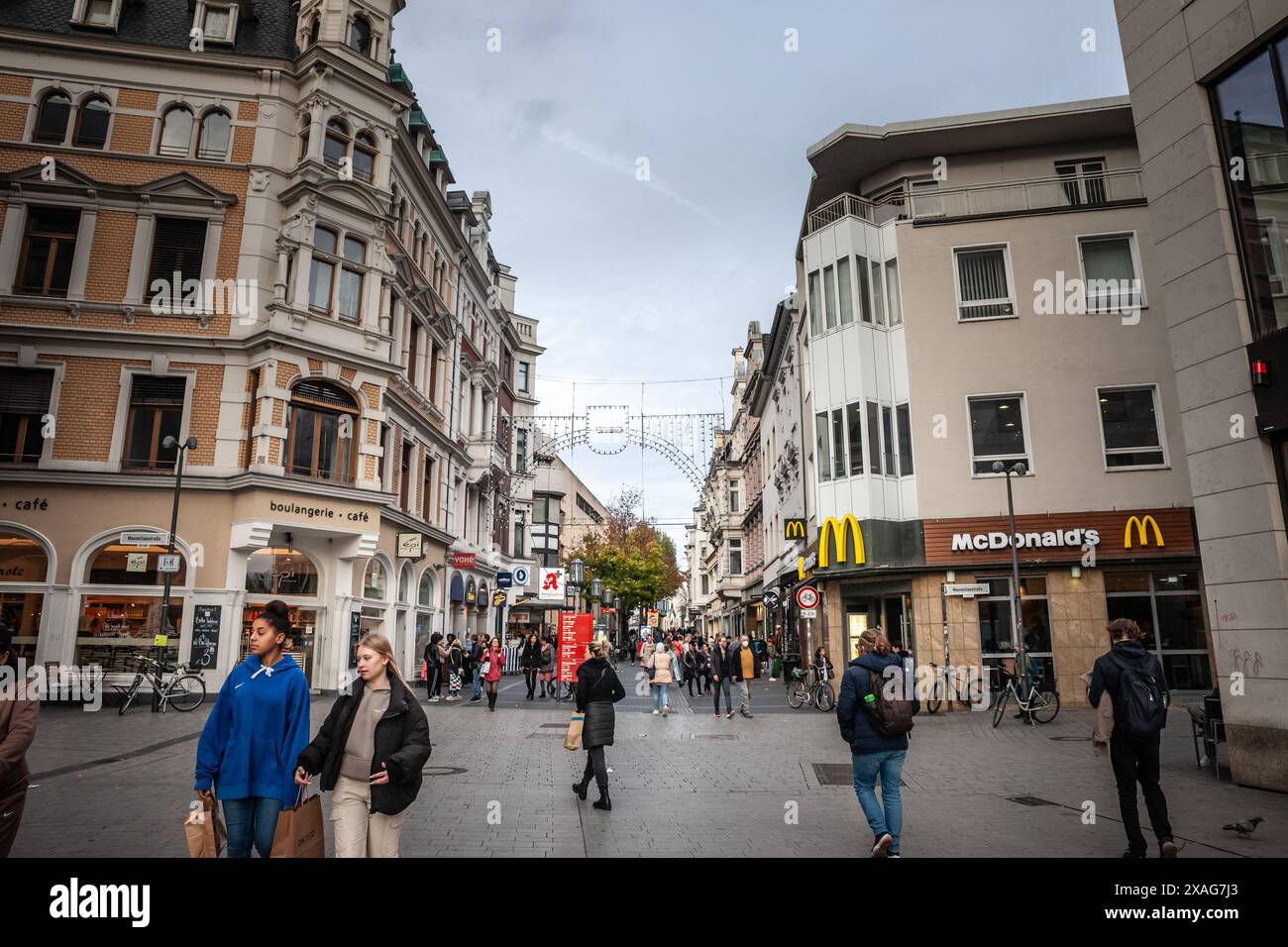 Picture of facades of a street of the center of bonn, with shops and boutiques, with a vintage german architecture, in the city center of Bonn, German Stock Photo