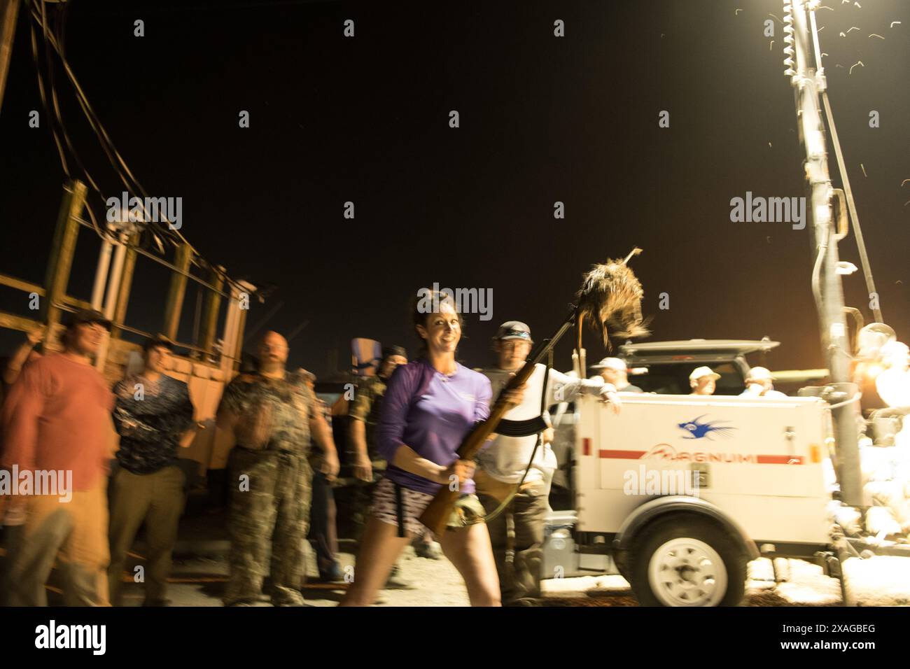 Armed nutria hunters proudly display their rifles at the annual Nutria ...