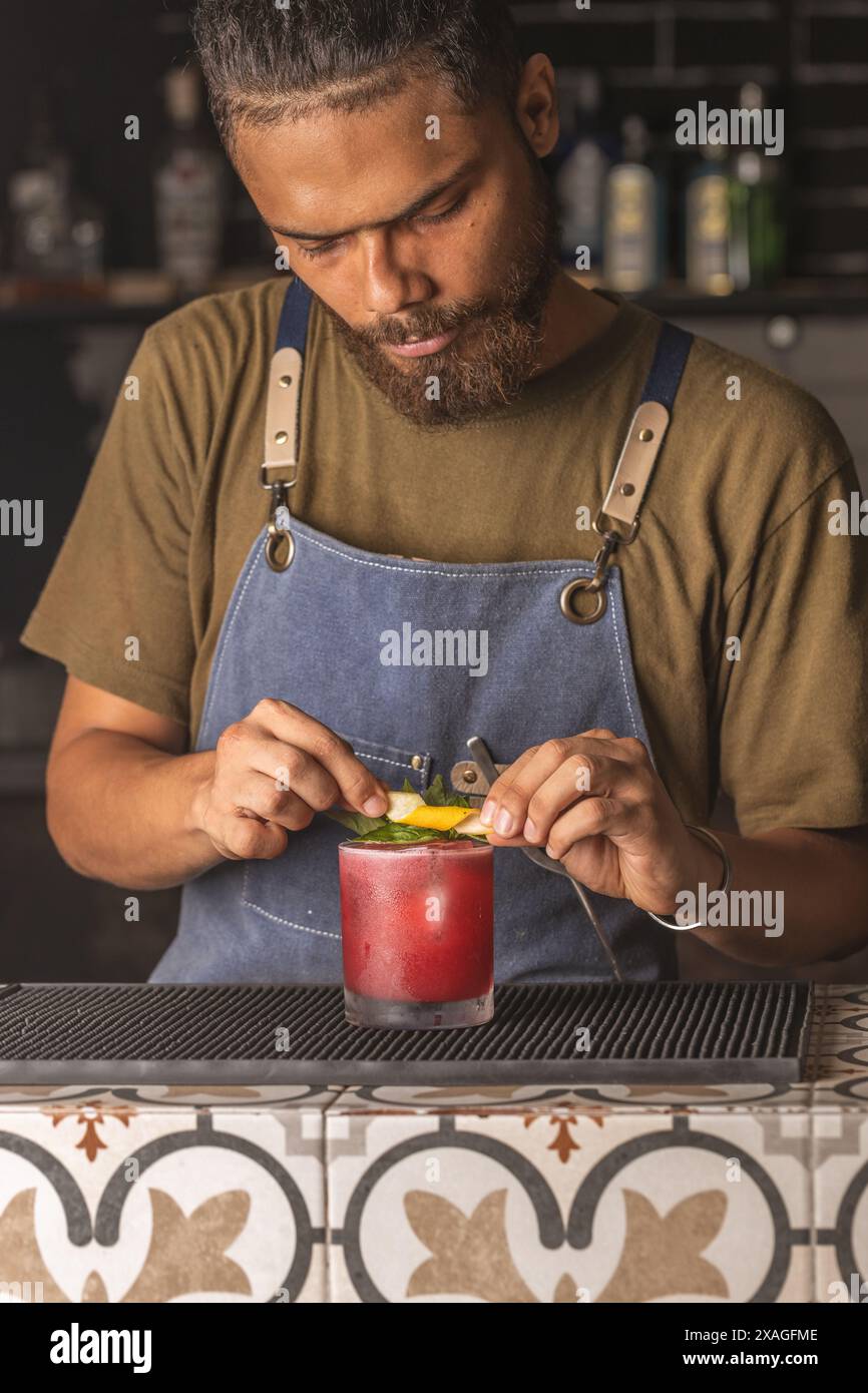 Drinks in a bar and barman Stock Photo