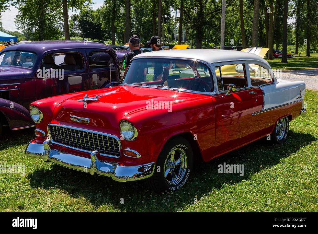 A classic red and white 1955 Chevrolet Bel Air on display at the DeKalb