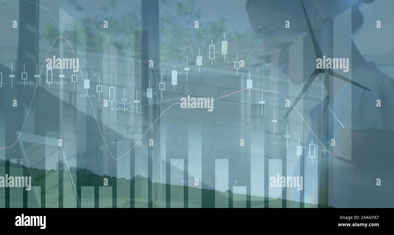 Image of graphs and data processing over landscape with wind turbine ...