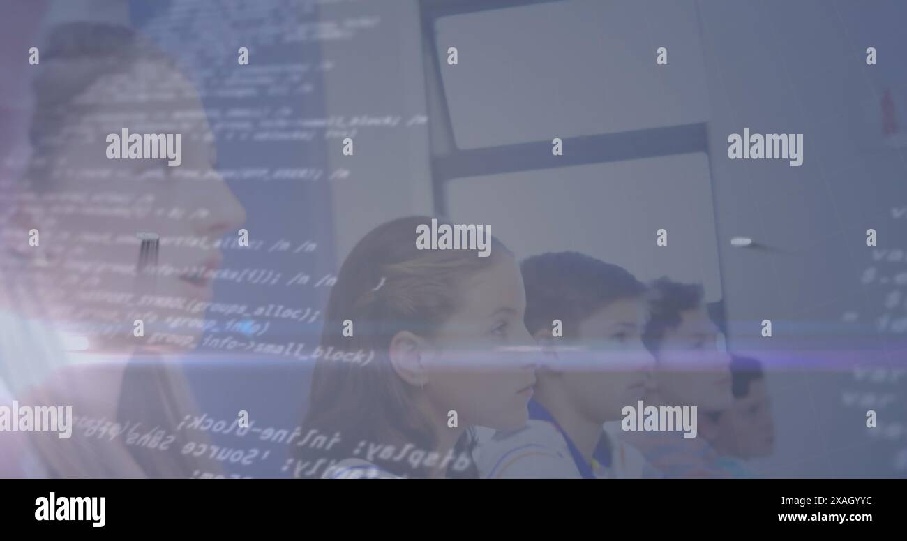 Group of Caucasian students in school classroom looking at screen Stock Photo