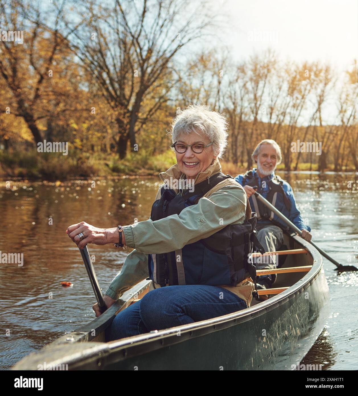 River, rowing and kayak with old couple, nature and retirement with ...
