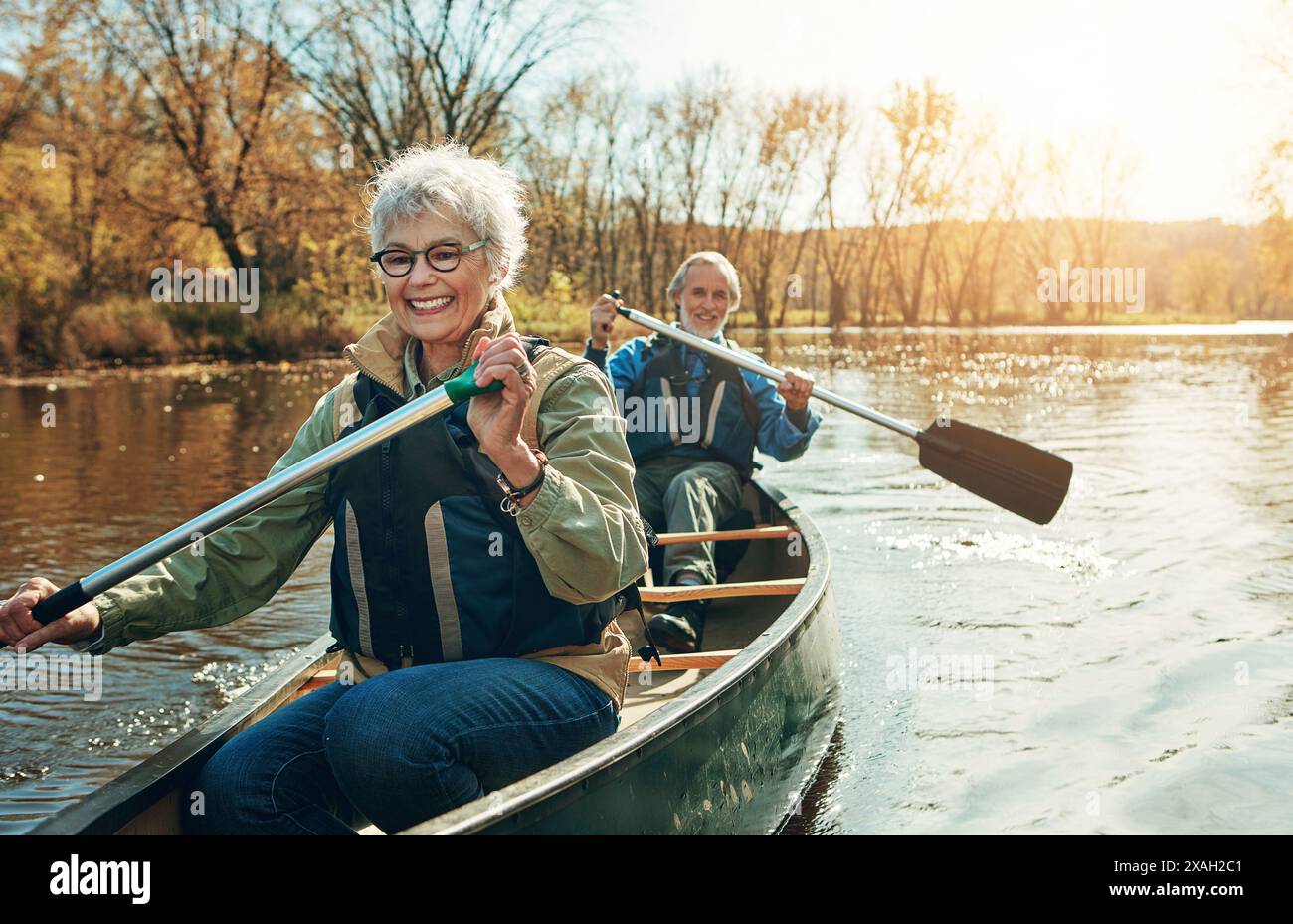 Lake, rowing and kayak with old couple, nature and retirement with ...