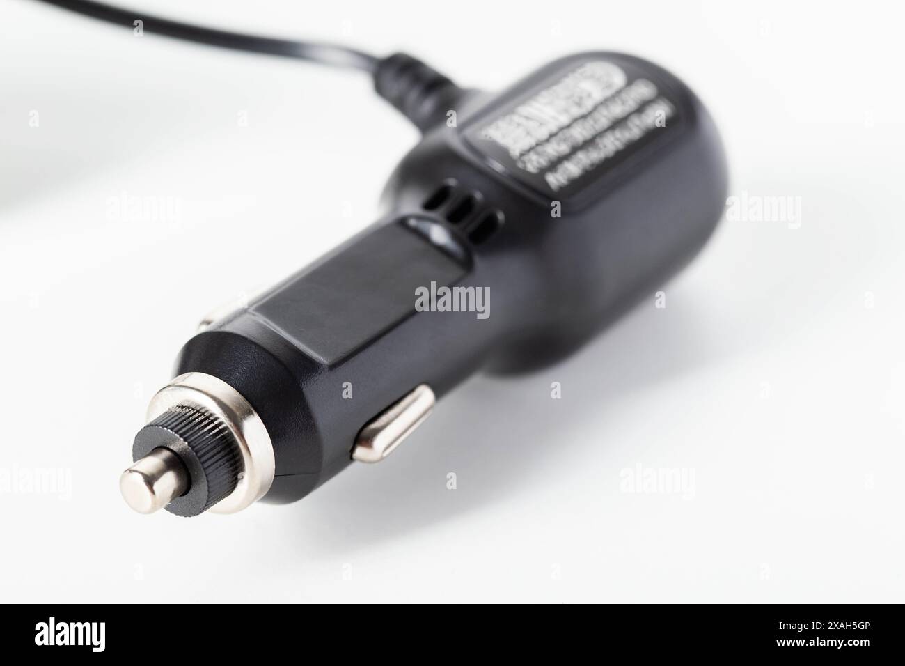 Electric adapter for charging into a car cigarette lighter on a white background, isolate Stock Photo