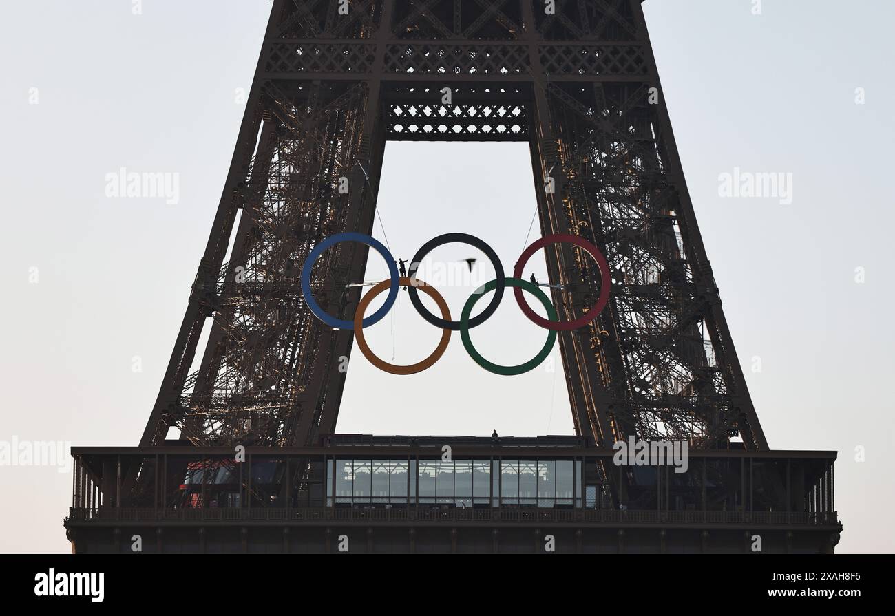 Paris, France. 7th June, 2024. The Olympic rings are seen on the Eiffel Tower, in Paris, France, on June 7, 2024. The Olympics rings are unveiled on the Eiffel Tower early in the morning of Friday as the French capital marks 50 days until the start of the upcoming Paris 2024 Olympic Games. Credit: Gao Jing/Xinhua/Alamy Live News Stock Photo