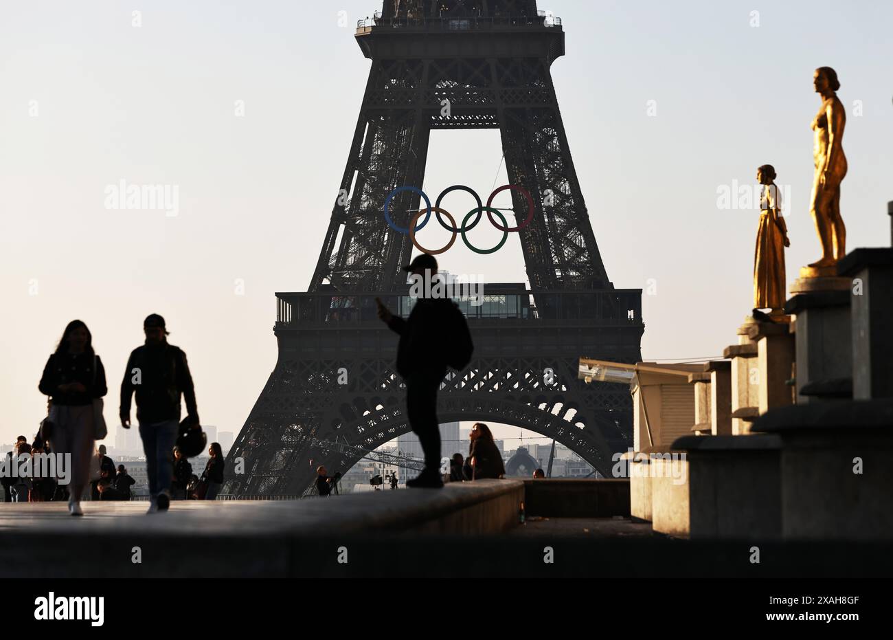 Paris, France. 7th June, 2024. The Olympic rings are seen on the Eiffel Tower, in Paris, France, on June 7, 2024. The Olympics rings are unveiled on the Eiffel Tower early in the morning of Friday as the French capital marks 50 days until the start of the upcoming Paris 2024 Olympic Games. Credit: Gao Jing/Xinhua/Alamy Live News Stock Photo