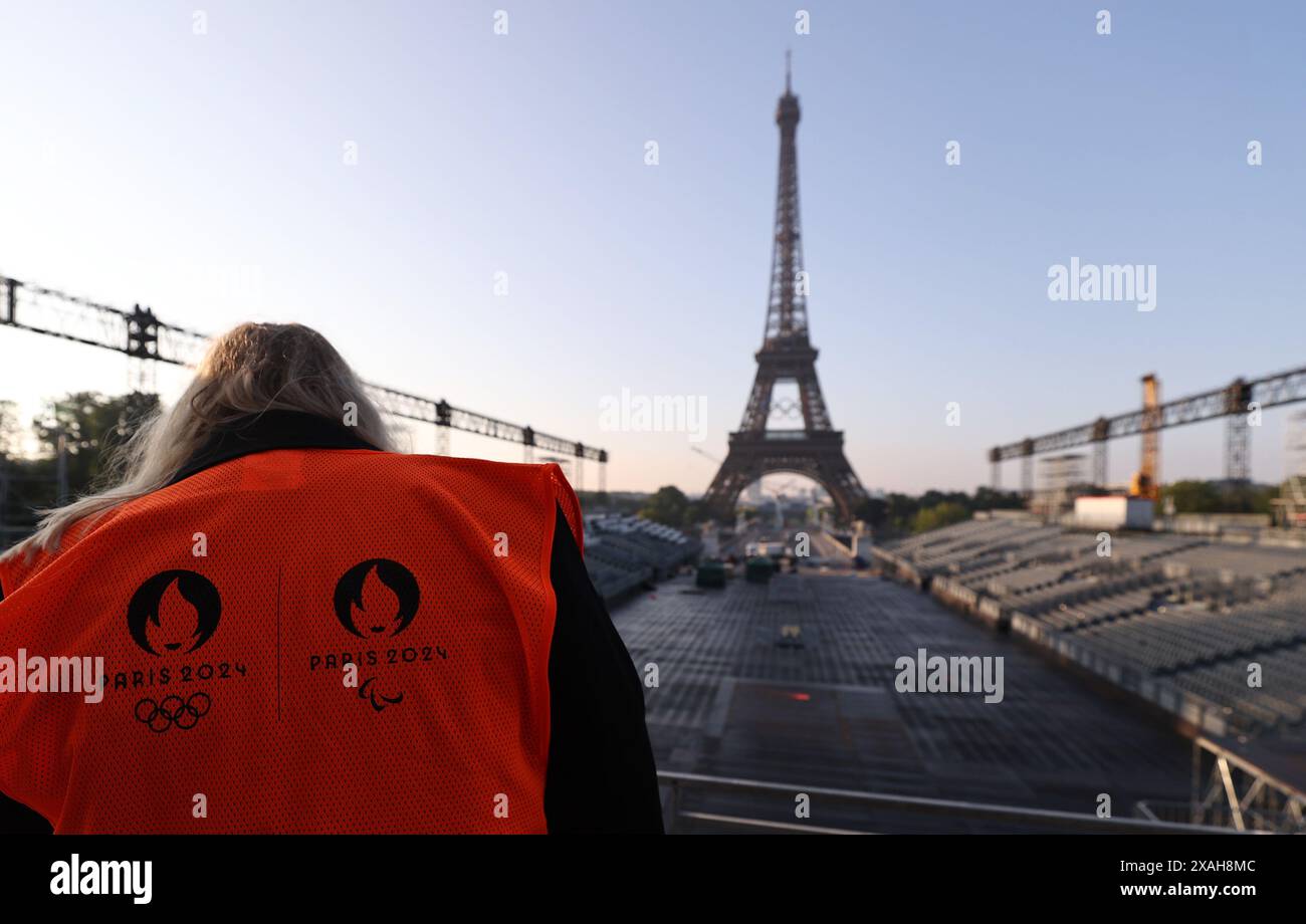 Paris, France. 7th June, 2024. The Olympic rings are seen on the Eiffel Tower, in Paris, France, on June 7, 2024. The Olympics rings are unveiled on the Eiffel Tower early in the morning of Friday as the French capital marks 50 days until the start of the upcoming Paris 2024 Olympic Games. Credit: Gao Jing/Xinhua/Alamy Live News Stock Photo