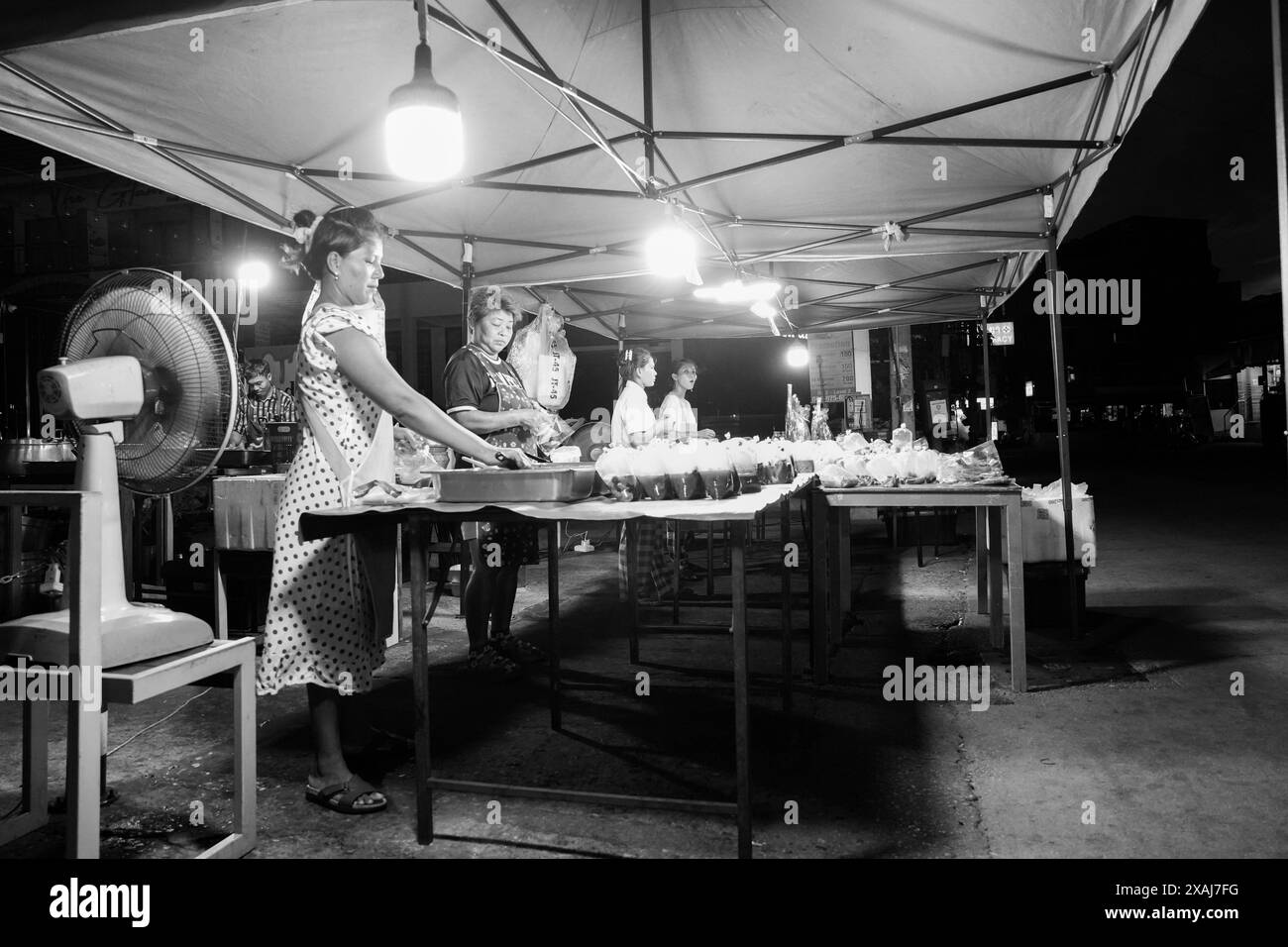 street life with buildings and people in Soi Buakhao of Pattaya district Chonburi in Thailand Asia in monochrome or black and white Stock Photo