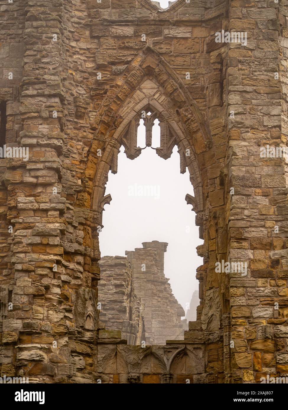 Thick sea Fog surrounds the ruins of Whitby Abbey, creating a haunting atmosphere that inspired Bram Stockers Dracula Stock Photo