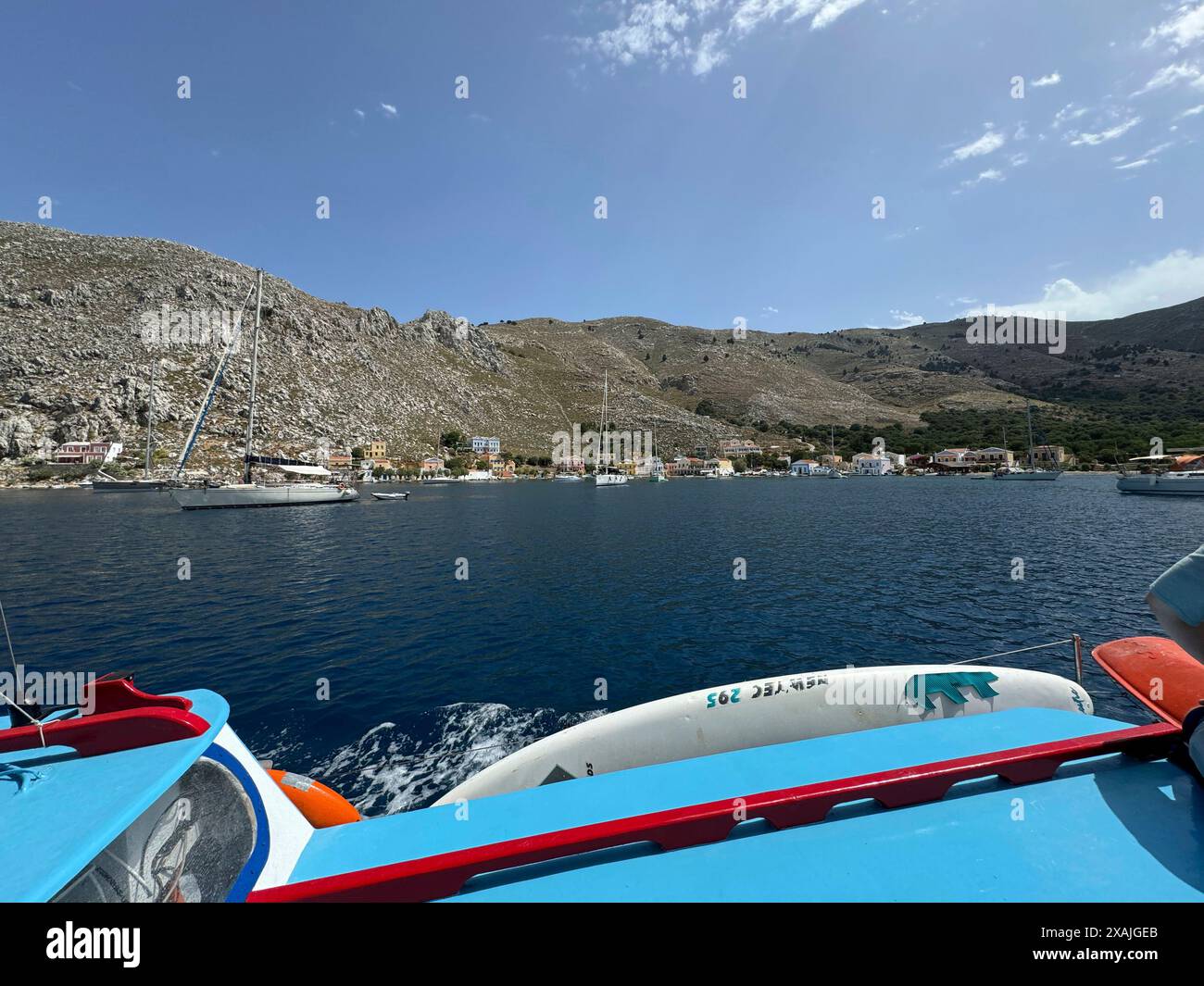 The small village of Pedi, where some reports indicate missing British doctor and TV presenter Michael Mosley was sighted, is seen on the southeastern Aegean Sea island of Symi, Greece, Friday, June, 7, 2024. Mosley went missing on Wednesday afternoon while on vacation on Symi, and authorities said a search and rescue operation that continued on Friday had found no trace of him. (AP Photo/Antonis Mystiloglou) Stock Photo