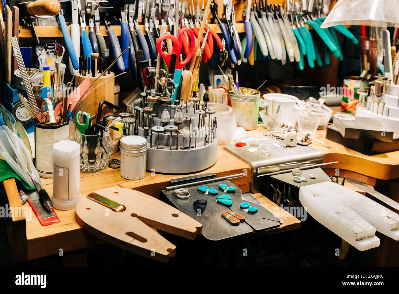 Jewelry makers bench with jewelry making tools and equipment Stock