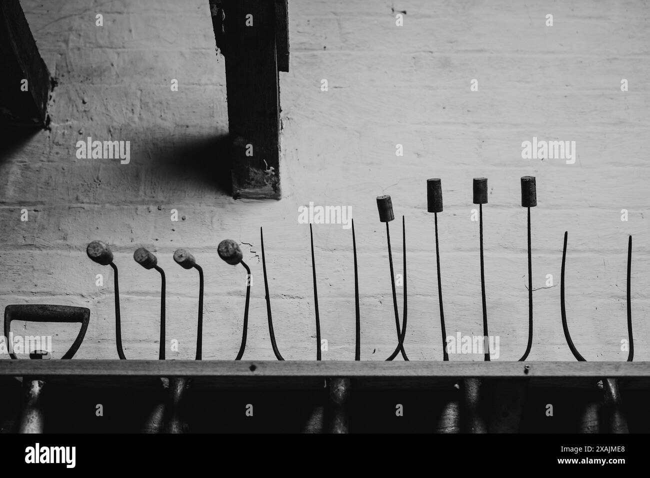 A row of garden tools with DIY safety measures, England Stock Photo