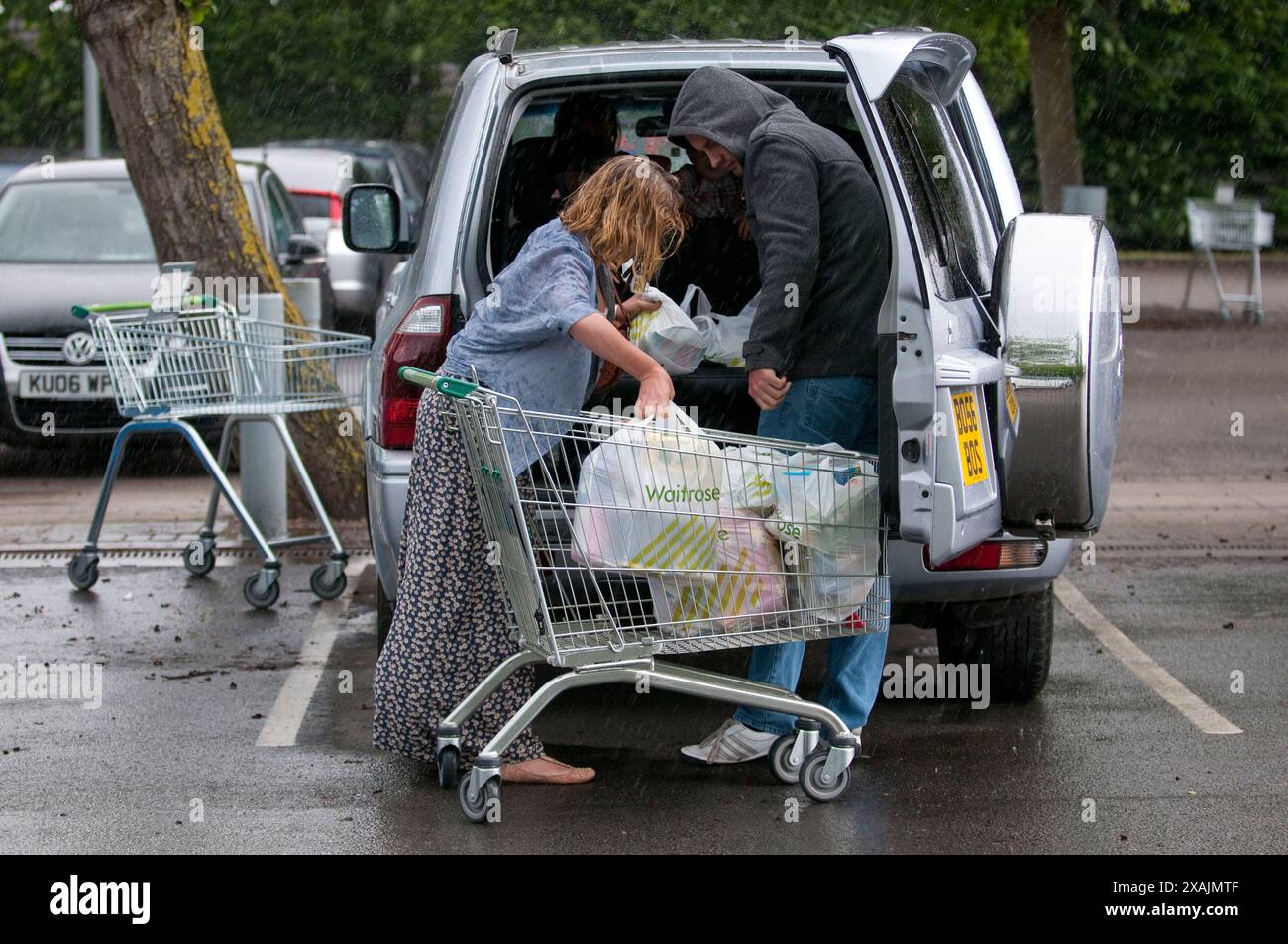 Charlotte Church and her children Ruby and Dexter together with her fella Jonathan Powell  look the perfect family group as they go shopping together at a local supermarket near her home outside Cardiff today.  But what a difference a couple of hours make... They arrived in warm sunshine and left in a torrential downpour. Stock Photo