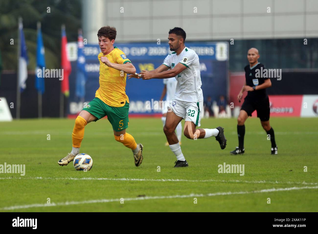 Bangladeshi defender MD Saad Uddin (R)  and Australia defender Jordan Bos during their second leg match of the FIFA World Cup Qualifiers at the Bashun Stock Photo