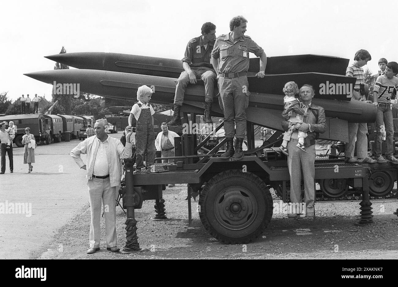 On the ramp of the Hawk air defense system, fathers, grandfathers, Bundeswehr soldiers and children watch a weapons show, military show of the Bundeswehr 'Our Air Force' on the Ochsenwiese Stock Photo