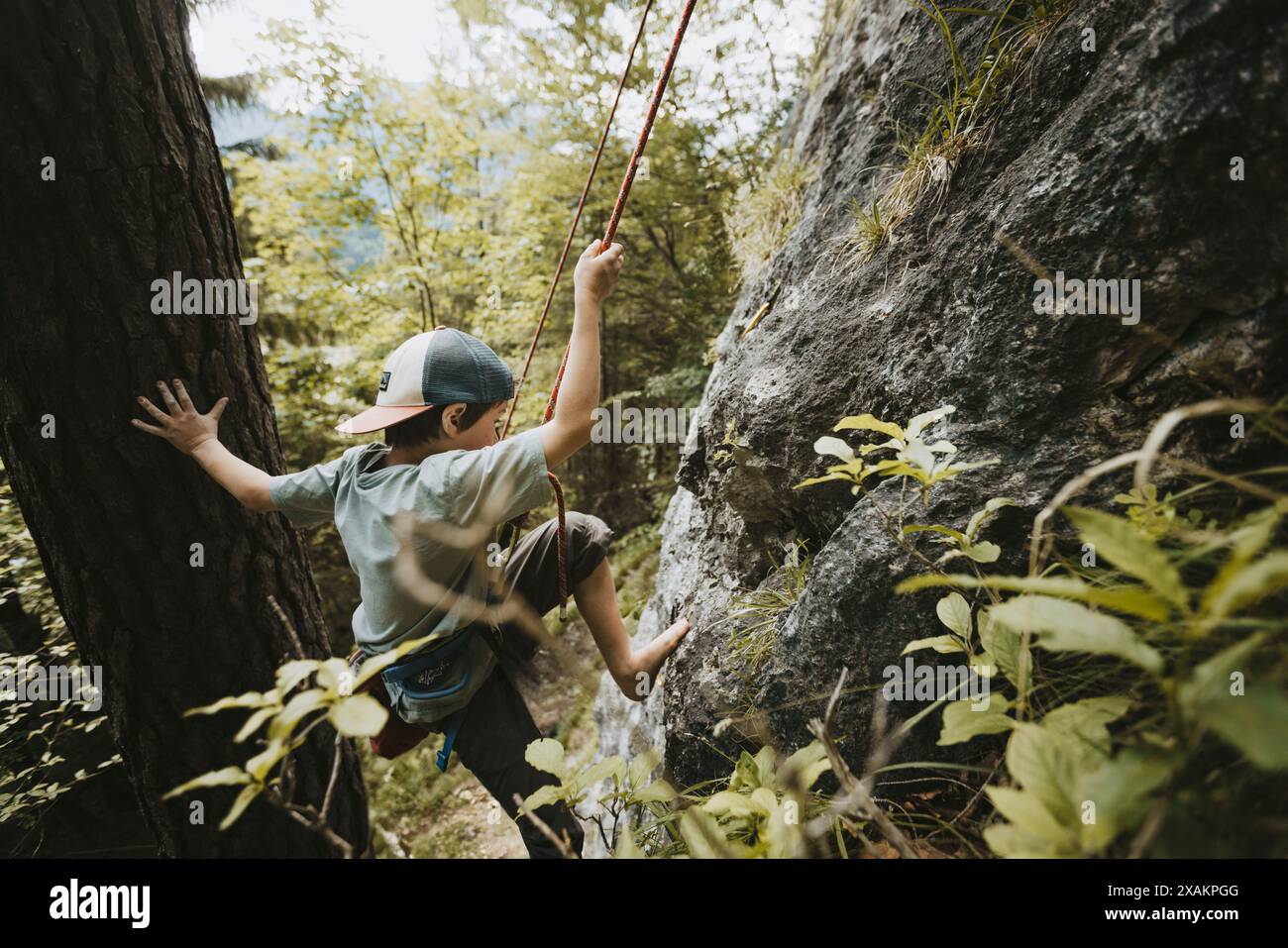 Boy climbing Stock Photo