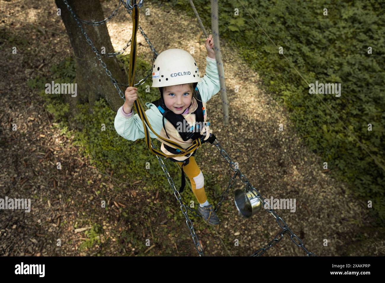 Girl in the climbing garden Stock Photo