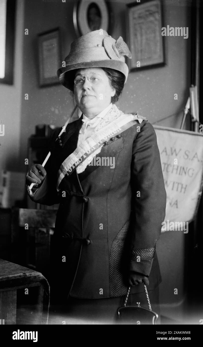 Miss Jenkins, between c1910 and c1915. Shows suffragist Miss Jenkins with a banner from the National American Women Suffrage Association. Stock Photo