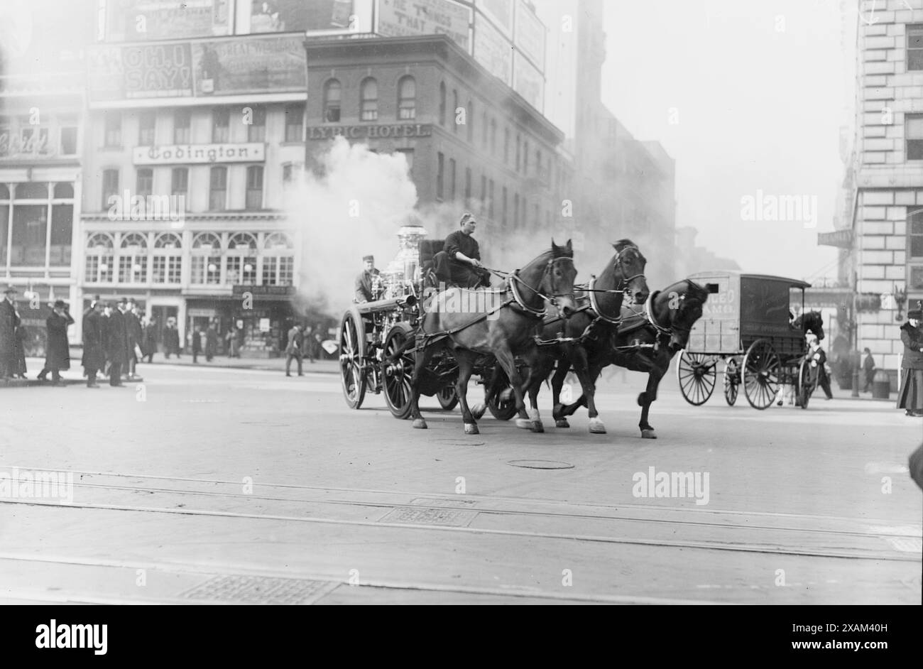 Going to a fire, between c1910 and c1915. Shows horse drawn fire vehicle at intersection of West 43rd Street and Broadway, New York City. Stock Photo