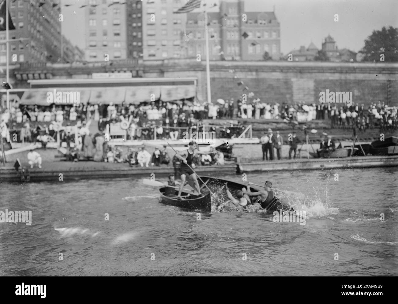 Canoe Tilting, between c1910 and c1915. Shows activities at the Colonial Yacht Club,which was located on the small beach just below Riverside Drive on the Hudson River, roughly between 140th and 142nd Streets in Harlem. Today, the Henry Hudson Parkway and North River Wastewater Treatment Plant are located in this area. Stock Photo