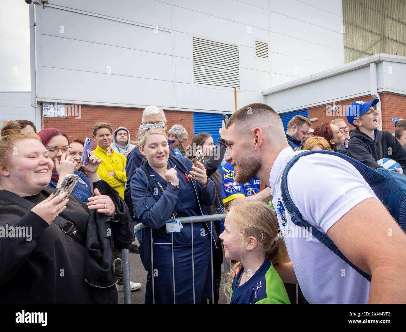 Warrington, Cheshire, UK. 06th June, 2024. Warrington Wolves left the The Halliwell Jones Stadium on 06 June 2024 and headed toward Wembley Stadium for The Rugby Football League Challenge Cup Final against Wigan. Supporters were there to see them off and get signatures and selfies with the players and manager Sam Burgess. Credit: John Hopkins/Alamy Live News Stock Photo